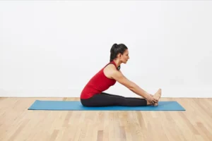 Seated forward bend to ease lower back pain yoga benefits